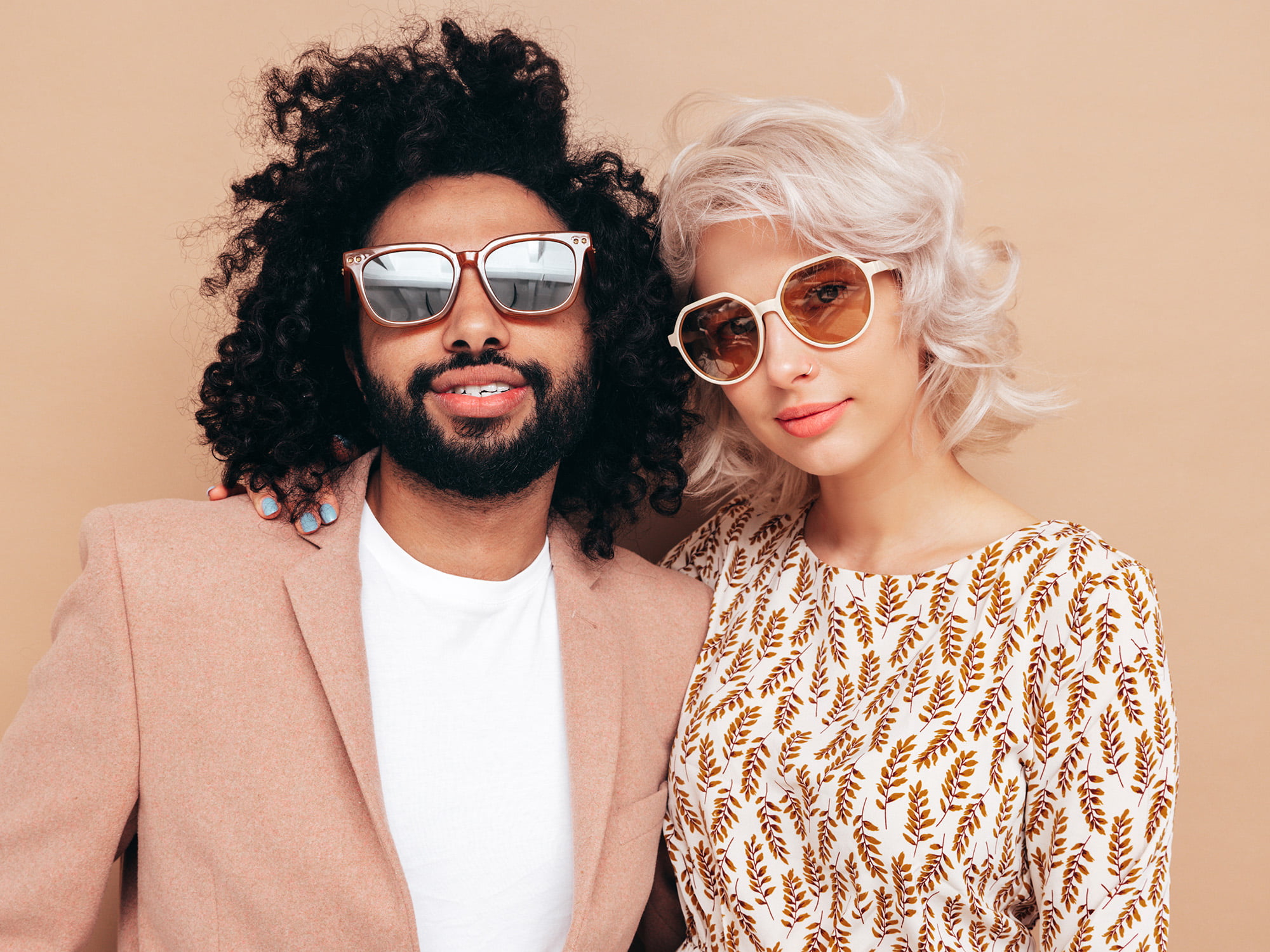 beautiful inter racial couple wearing stylish glasses
